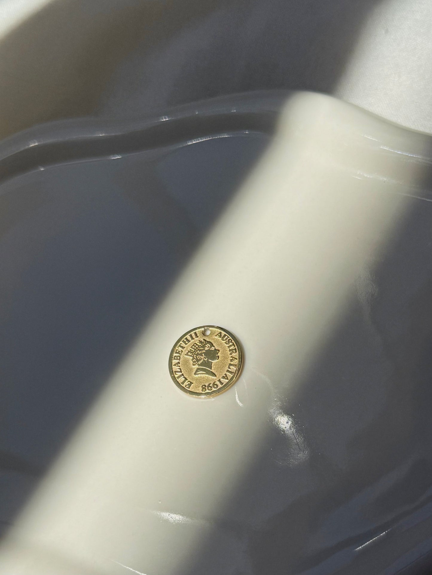Breloque pièce royale